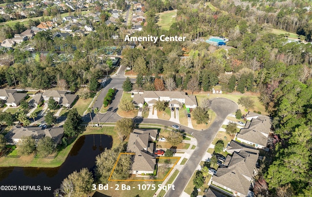 bird's eye view with a water view and a residential view