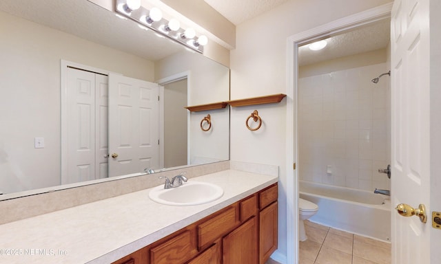 bathroom featuring a textured ceiling, toilet, vanity, tile patterned floors, and washtub / shower combination