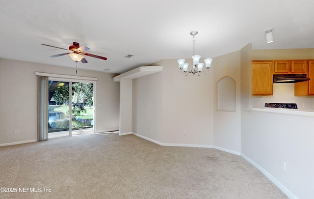 interior space featuring light carpet, ceiling fan with notable chandelier, visible vents, and baseboards