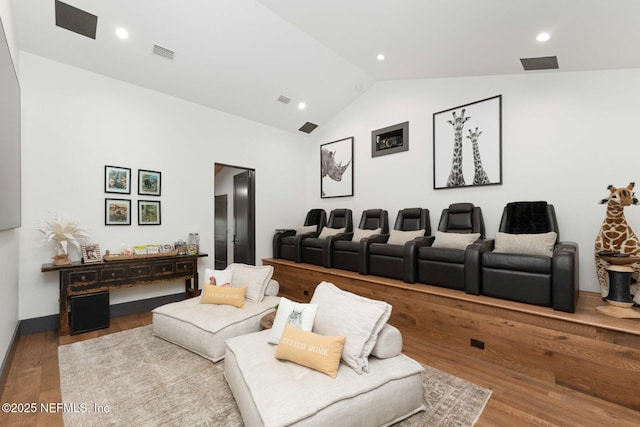 home theater with high vaulted ceiling, visible vents, wood finished floors, and recessed lighting