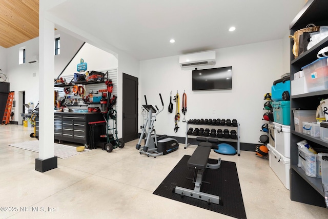 exercise area with a wall unit AC and recessed lighting