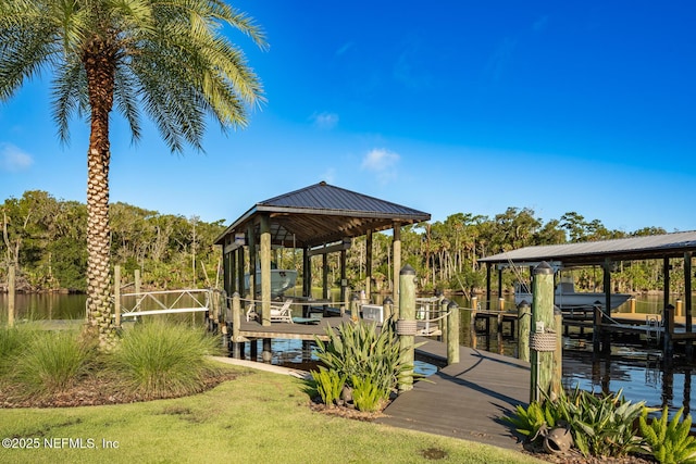 dock area featuring boat lift and fence