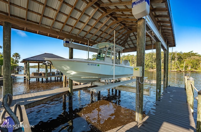 view of dock featuring a water view and boat lift