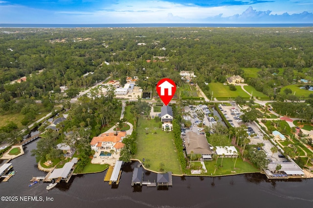 bird's eye view with a water view, a residential view, and a view of trees