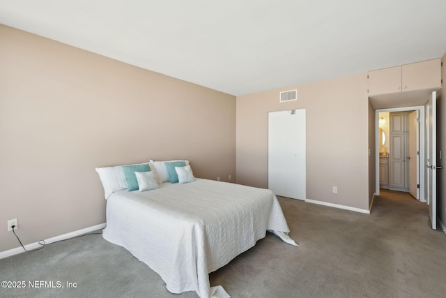 carpeted bedroom featuring visible vents and baseboards