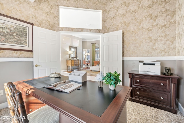 office space featuring a high ceiling and ornamental molding