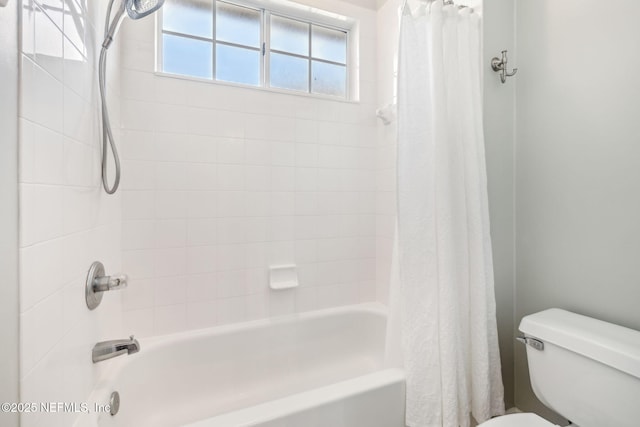 full bathroom featuring toilet and shower / bath combo with shower curtain