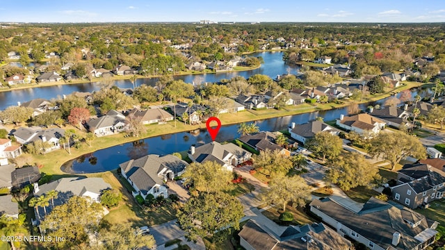 bird's eye view featuring a water view and a residential view