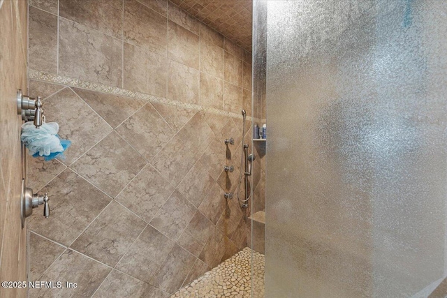 interior space featuring a tile shower