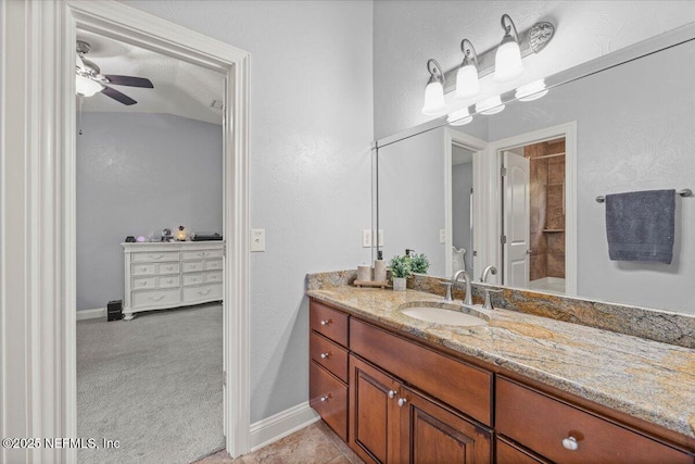 full bathroom featuring baseboards, ceiling fan, tile patterned flooring, a textured ceiling, and vanity