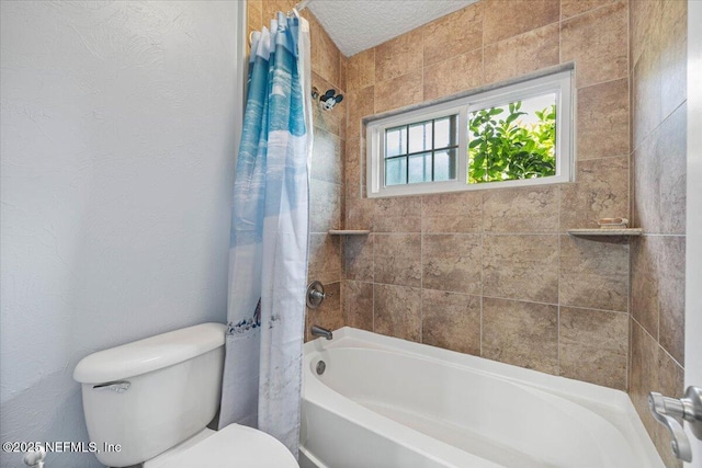 bathroom featuring a textured ceiling, toilet, and shower / bath combo with shower curtain