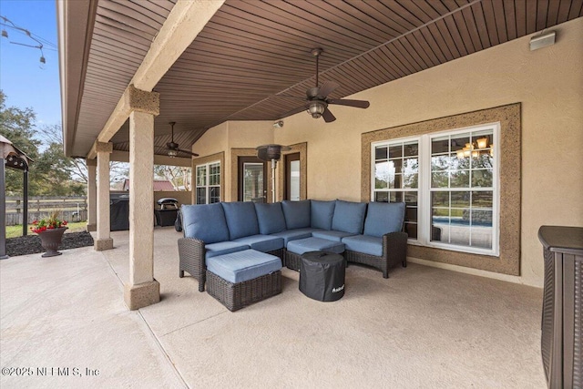 view of patio featuring ceiling fan and an outdoor living space