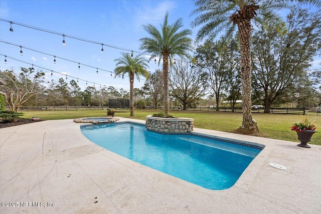 view of pool featuring a yard, a patio area, a fenced backyard, and a pool with connected hot tub