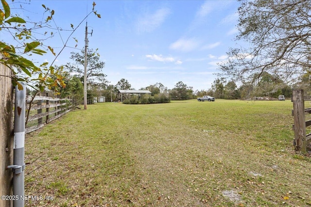 view of yard with fence