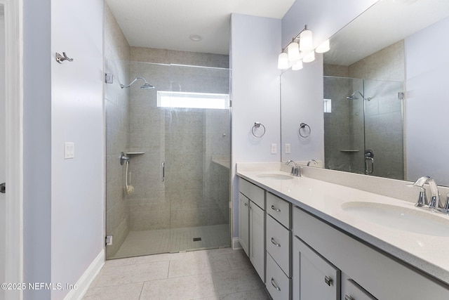 bathroom featuring a sink, a shower stall, and double vanity