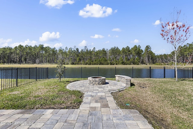 view of yard featuring a patio, an outdoor fire pit, and a fenced backyard