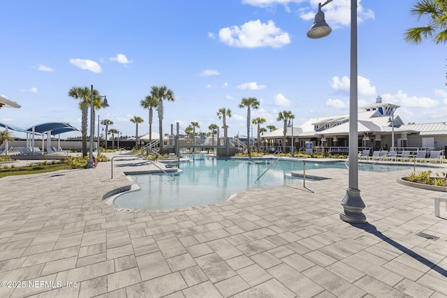 community pool featuring a patio area