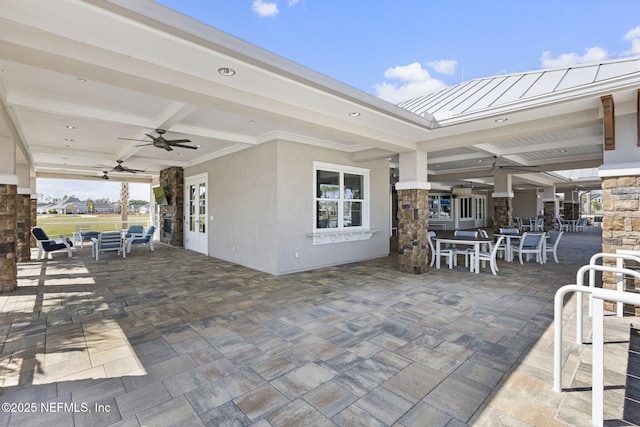 view of patio / terrace featuring outdoor dining area and ceiling fan