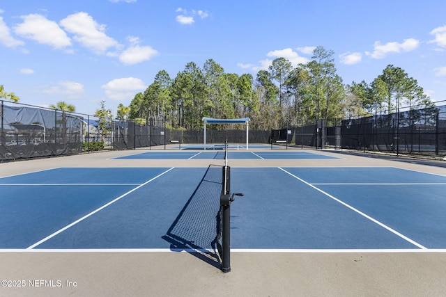 view of sport court with community basketball court and fence