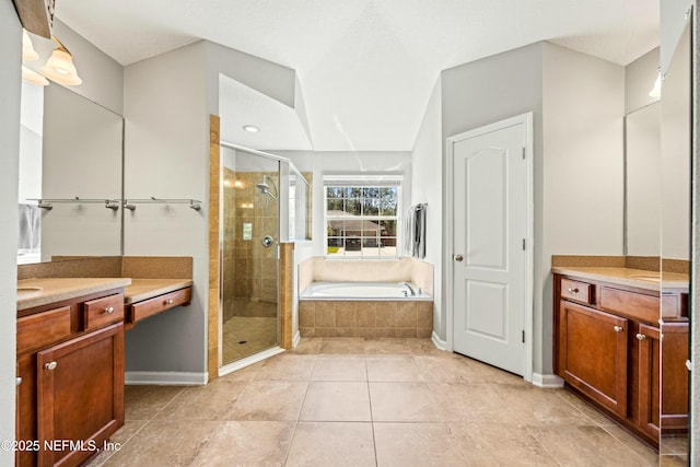 full bath with baseboards, tile patterned flooring, vanity, a shower stall, and a bath