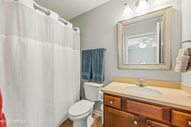 full bathroom with a textured ceiling, toilet, and vanity