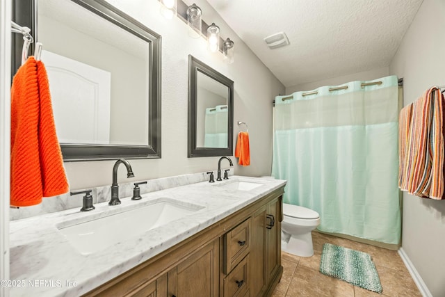 bathroom featuring visible vents, a sink, a textured ceiling, and toilet