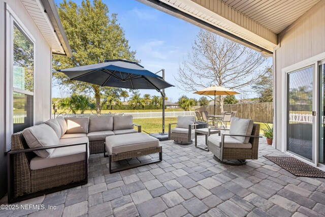 view of patio with outdoor lounge area and a fenced backyard