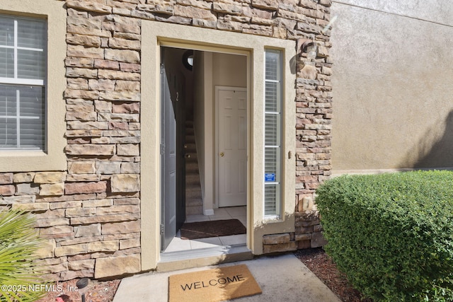 7157 Deerfoot Point Cir Unit 10-2, Jacksonville, FL 32256 - doorway to property featuring stone siding