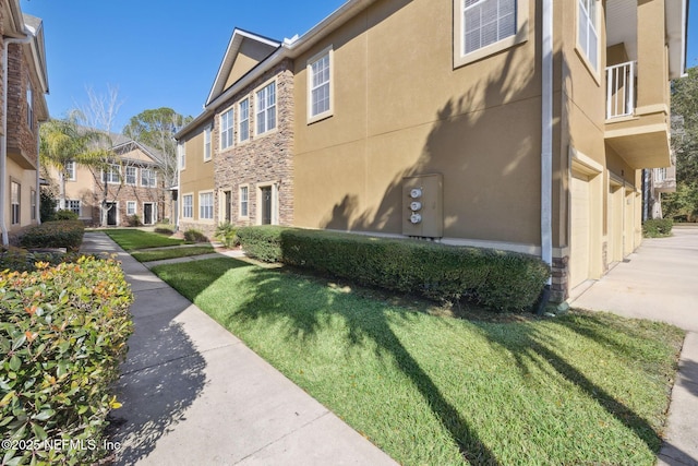 view of community with a residential view and a lawn