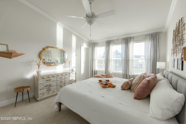 bedroom featuring baseboards, ceiling fan, light colored carpet, and crown molding