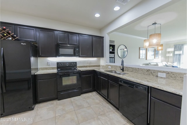 kitchen with crown molding, hanging light fixtures, a sink, light stone countertops, and black appliances