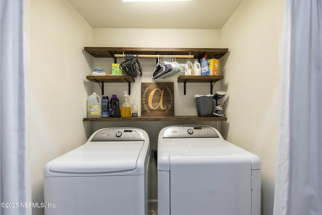 washroom with laundry area and washer and clothes dryer