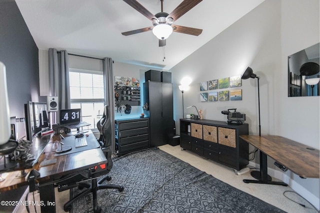 office featuring lofted ceiling, ceiling fan, and carpet floors