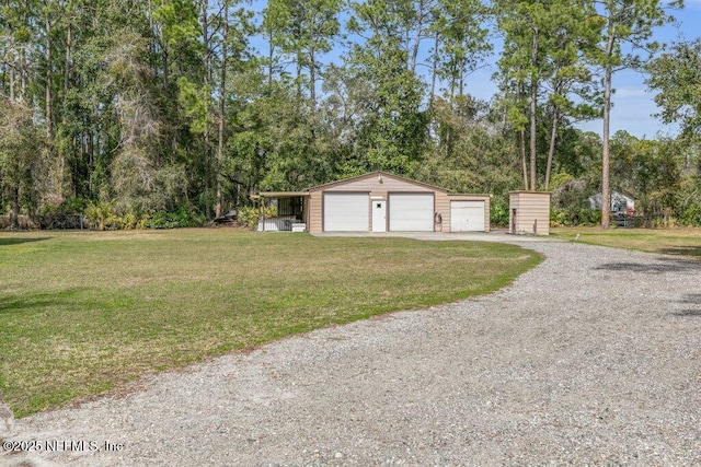 exterior space featuring a detached garage and driveway