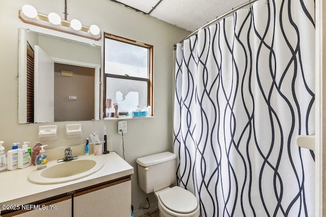 bathroom with toilet, curtained shower, and vanity