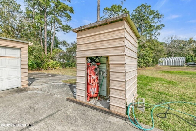 view of shed with a garage