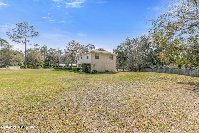 view of yard with fence