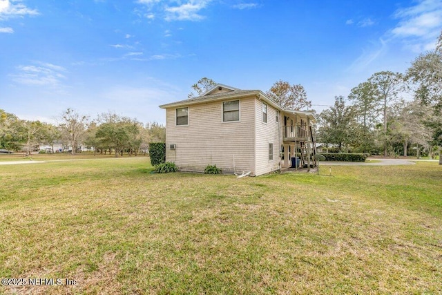 view of home's exterior featuring a lawn