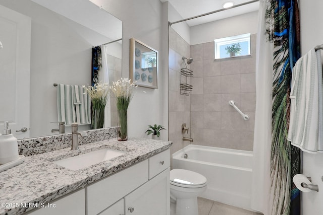 full bath with washtub / shower combination, vanity, toilet, and tile patterned floors