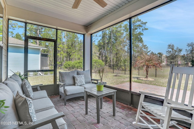 sunroom / solarium with ceiling fan and a healthy amount of sunlight