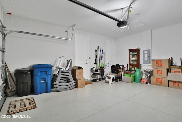 garage with electric panel and a garage door opener