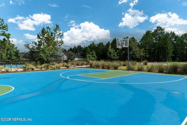 view of basketball court with community basketball court and fence