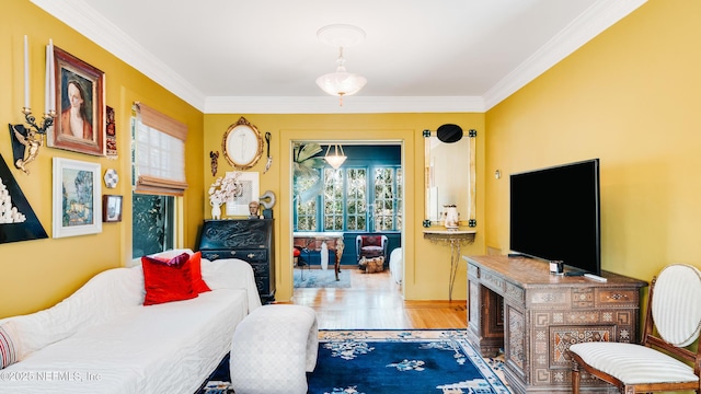 living room featuring crown molding and wood finished floors