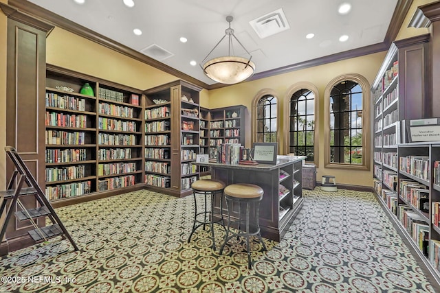 carpeted office featuring ornamental molding, wall of books, recessed lighting, and visible vents