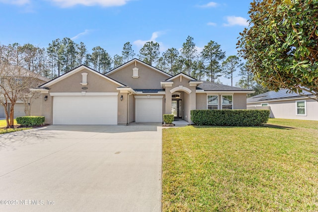 ranch-style house with a garage, driveway, a front yard, and stucco siding