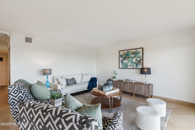 living room featuring baseboards, visible vents, and crown molding