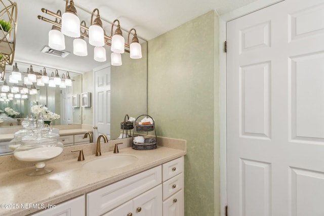 bathroom featuring visible vents and vanity