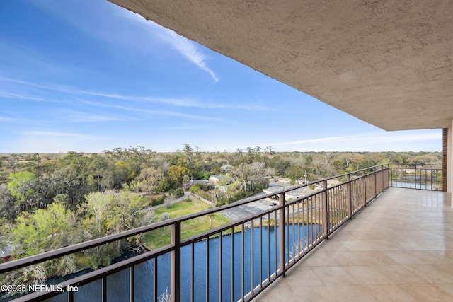 balcony featuring a water view