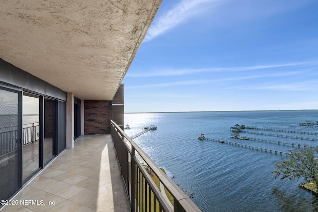 balcony featuring a water view