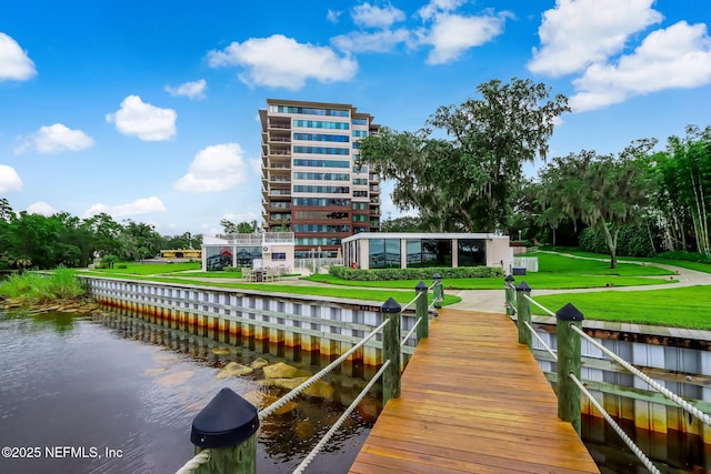 dock area featuring a water view and a yard